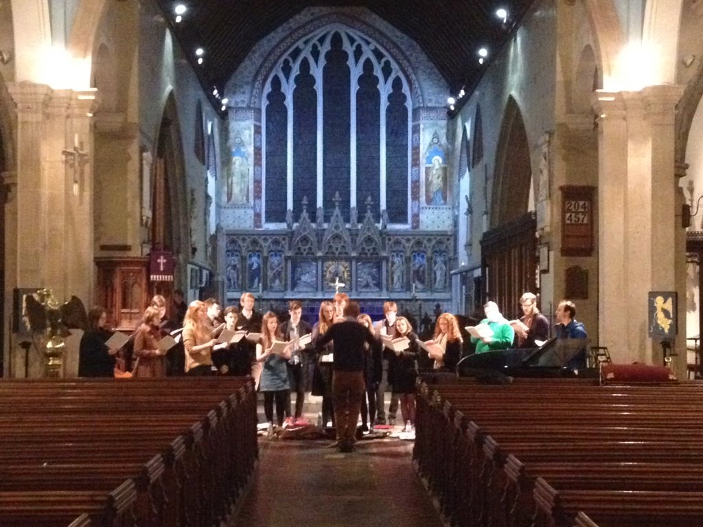The choir rehearse before the concert.